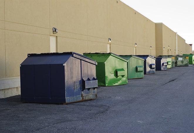 metallic dumpster units staged for construction garbage in Maple Plain